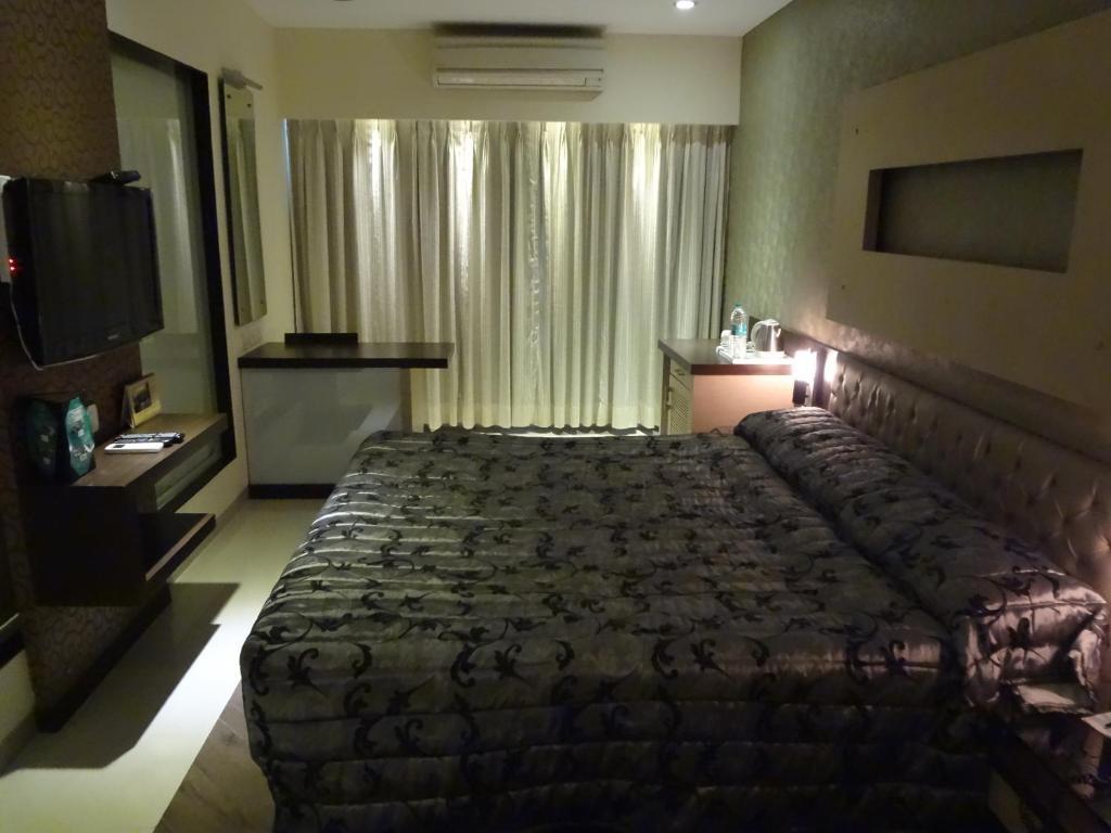 Hotel Capitol Thane Quarto foto